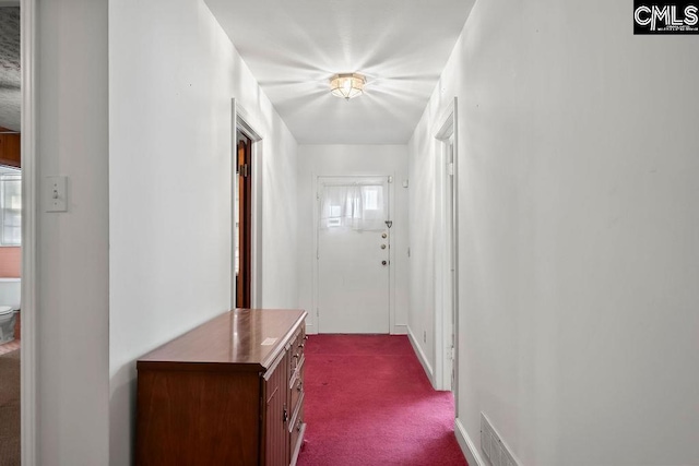 corridor with carpet flooring