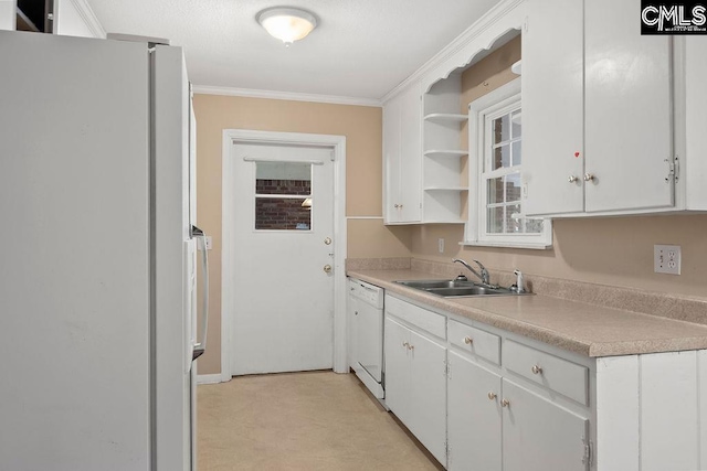 kitchen featuring crown molding, sink, white cabinets, and white appliances