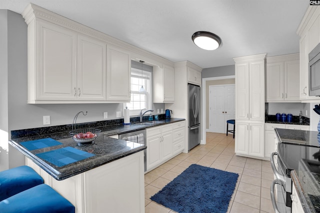 kitchen with white cabinetry and appliances with stainless steel finishes