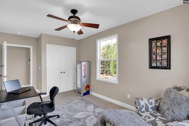 home office featuring ceiling fan and light colored carpet