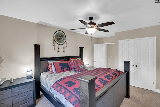 bedroom featuring ceiling fan, a closet, and light carpet