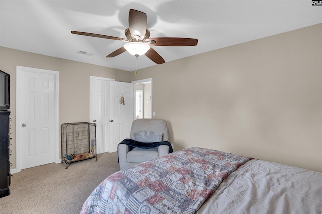 bedroom with light colored carpet and ceiling fan