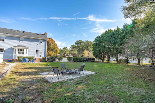 view of yard with a fire pit