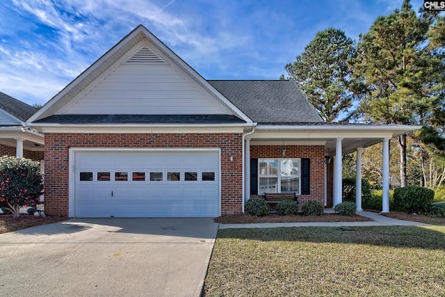 view of front of property featuring a garage and a front lawn