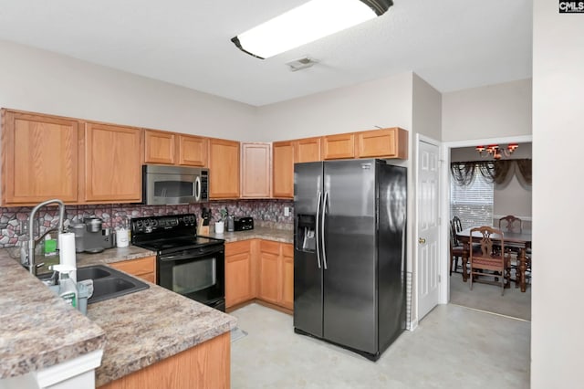 kitchen featuring fridge with ice dispenser, light stone countertops, sink, black range with electric cooktop, and decorative backsplash