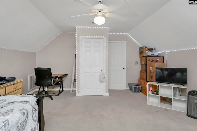 carpeted bedroom with vaulted ceiling and ceiling fan