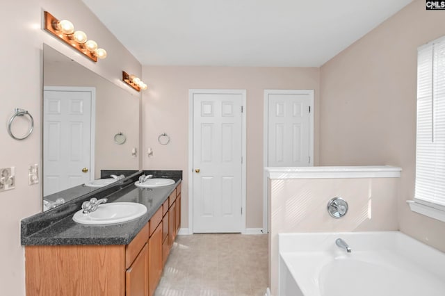 bathroom with a bathing tub and vanity