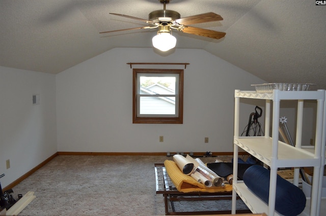 bonus room with carpet, a textured ceiling, ceiling fan, and lofted ceiling