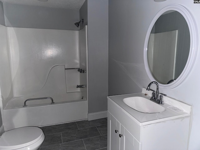 full bathroom featuring tub / shower combination, tile patterned floors, a textured ceiling, toilet, and vanity