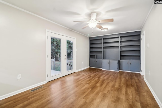 unfurnished living room with french doors, ceiling fan, ornamental molding, and hardwood / wood-style floors