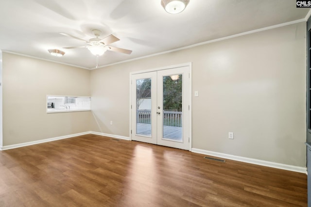 spare room with ceiling fan, wood-type flooring, ornamental molding, and french doors