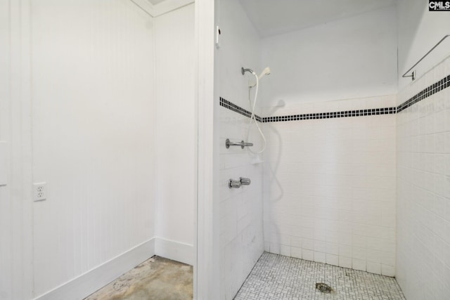 bathroom with a tile shower