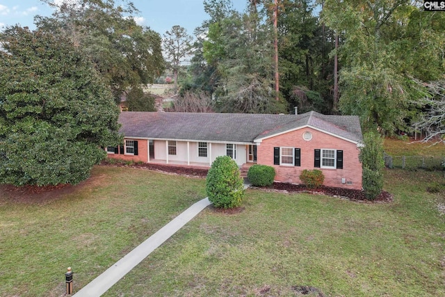 ranch-style house with a front lawn