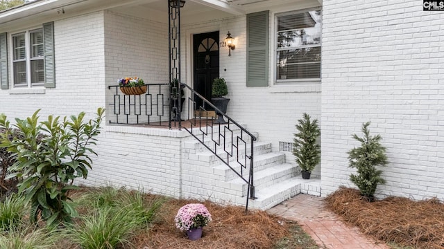 doorway to property with a porch