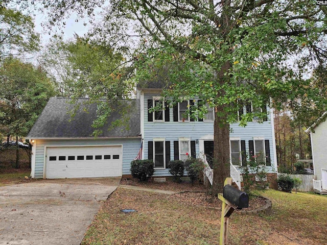 colonial house featuring a garage