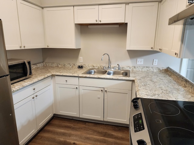 kitchen featuring white cabinets, sink, appliances with stainless steel finishes, and dark wood-type flooring