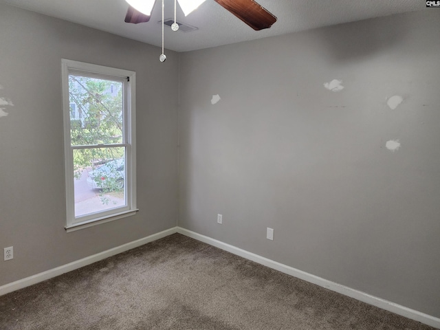 unfurnished room featuring carpet flooring and ceiling fan