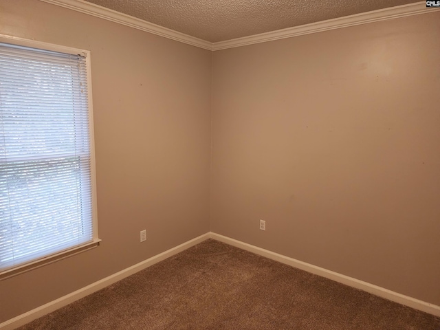 carpeted spare room with a textured ceiling, plenty of natural light, and crown molding