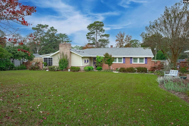 ranch-style home with a front lawn