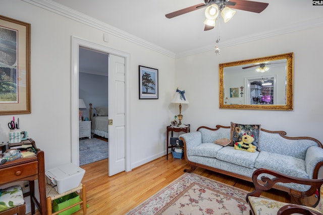 living room featuring wood-type flooring and ornamental molding