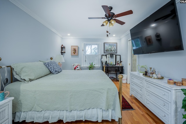 bedroom with ceiling fan, light hardwood / wood-style flooring, and crown molding