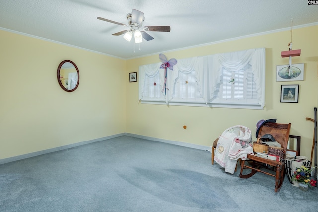 sitting room with carpet floors and crown molding