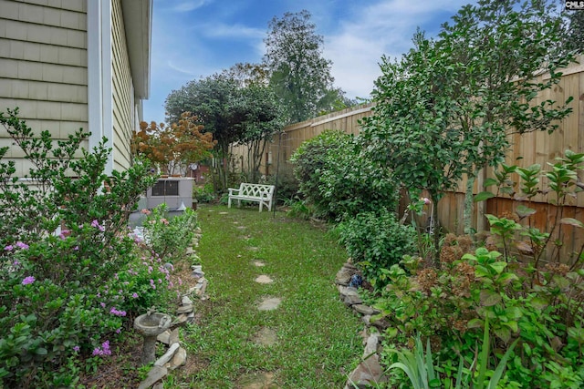 view of yard with central AC