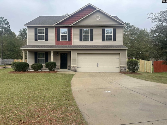 view of front of home featuring a front yard and a garage