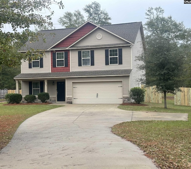 view of front facade featuring a garage and a front yard