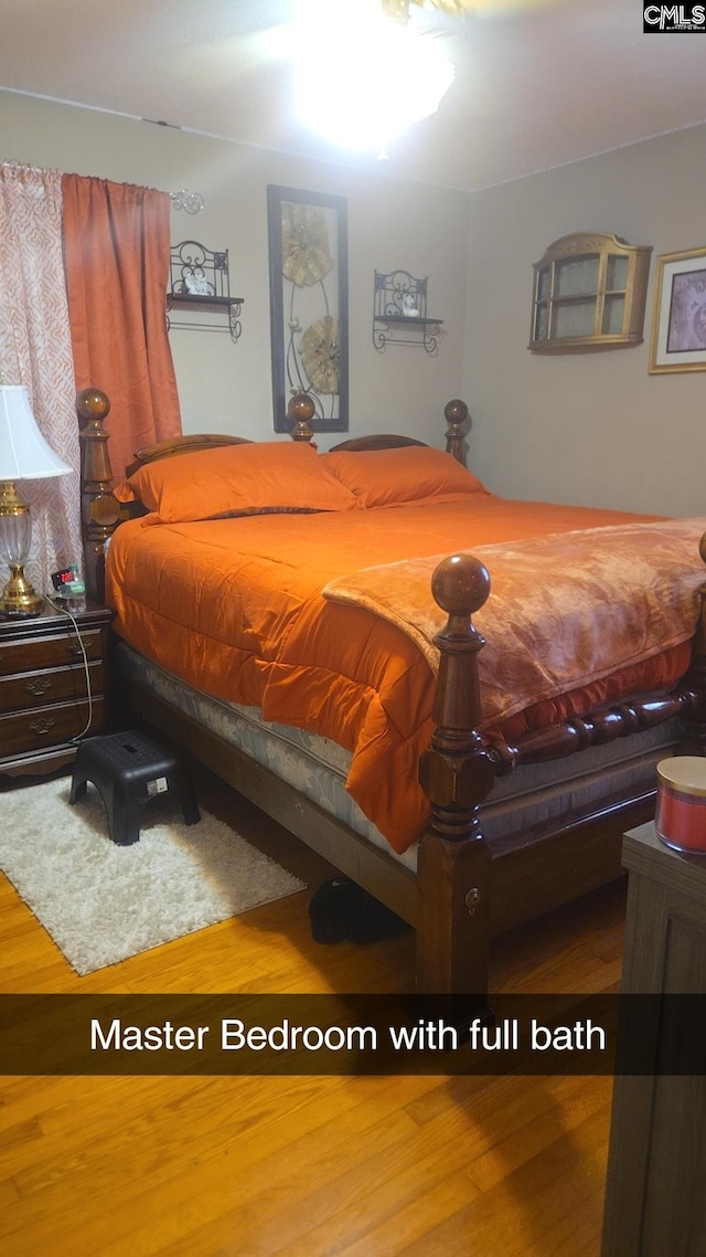 bedroom featuring hardwood / wood-style floors