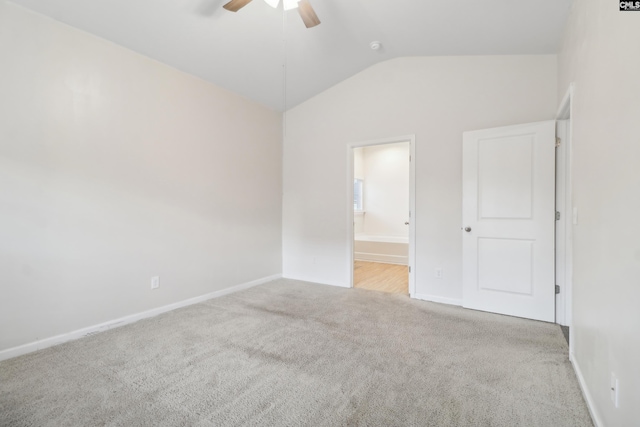 unfurnished room with light carpet, ceiling fan, and vaulted ceiling