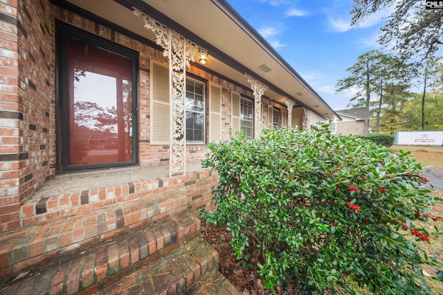 property entrance with covered porch