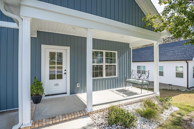 property entrance featuring a porch