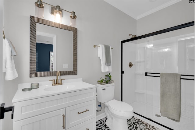 bathroom with tile patterned flooring, toilet, vanity, a shower with shower door, and ornamental molding