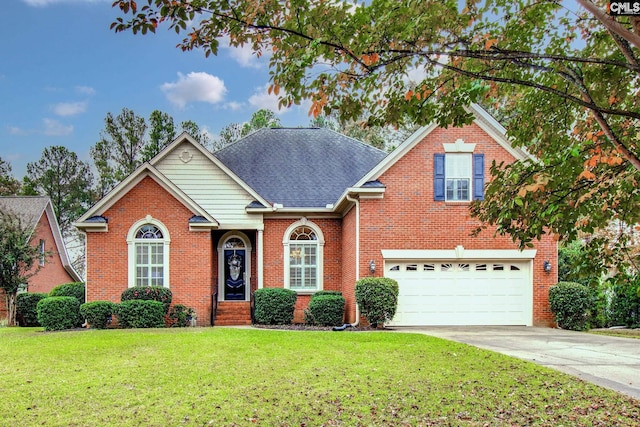 front of property featuring a front yard and a garage