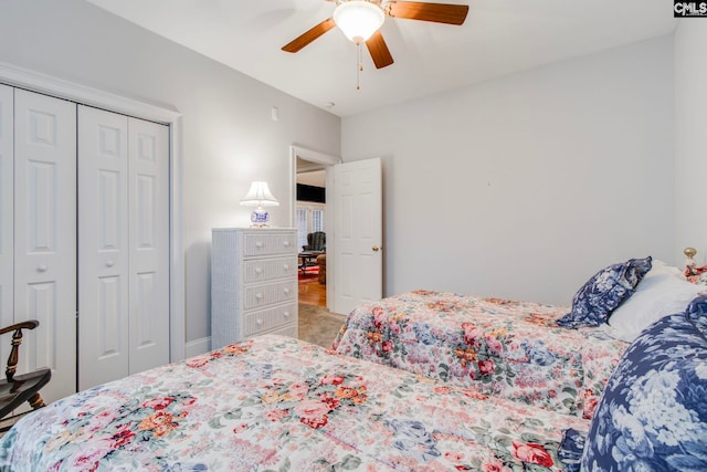 bedroom with ceiling fan and a closet