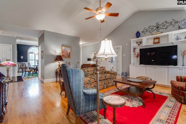 living room with light hardwood / wood-style floors, vaulted ceiling, and ceiling fan