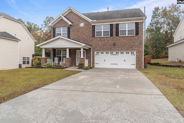 craftsman-style home with a porch, a garage, and a front yard