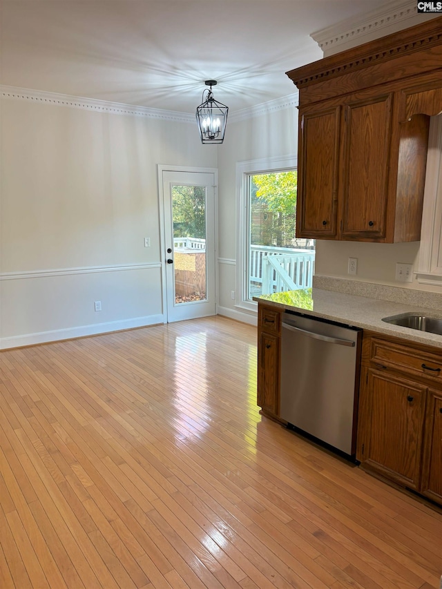 kitchen featuring dishwasher, light wood-type flooring, hanging light fixtures, and ornamental molding