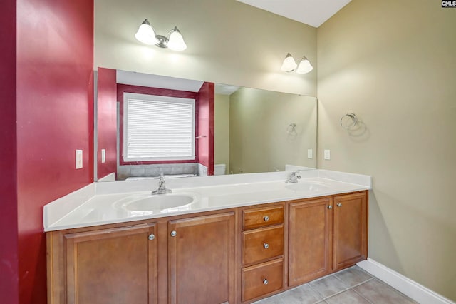 bathroom featuring tile patterned floors, vanity, and toilet