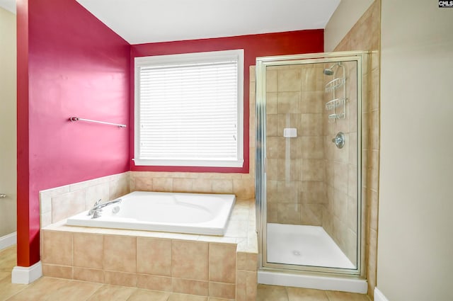 bathroom with tile patterned floors and separate shower and tub