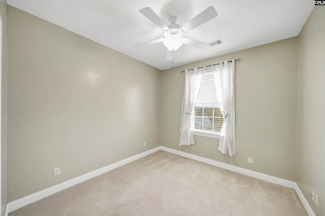 unfurnished room featuring light carpet and ceiling fan