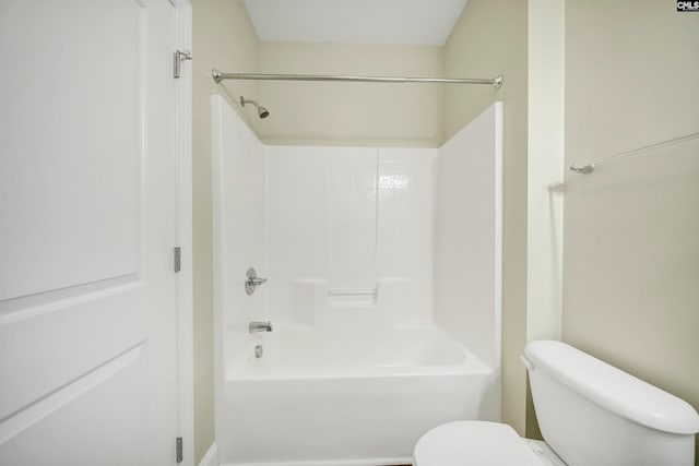 bathroom featuring  shower combination and toilet