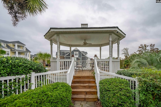 exterior space with ceiling fan