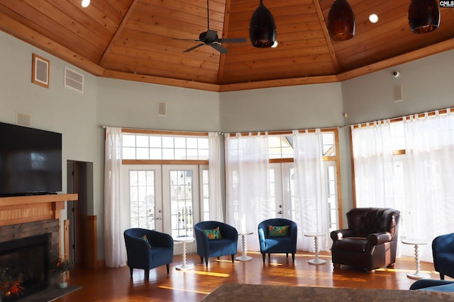 living room with french doors, hardwood / wood-style flooring, high vaulted ceiling, and wooden ceiling