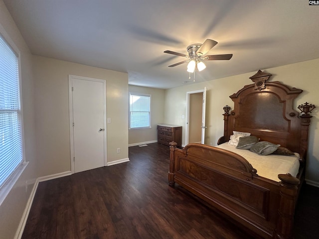 bedroom featuring ceiling fan and dark wood-type flooring