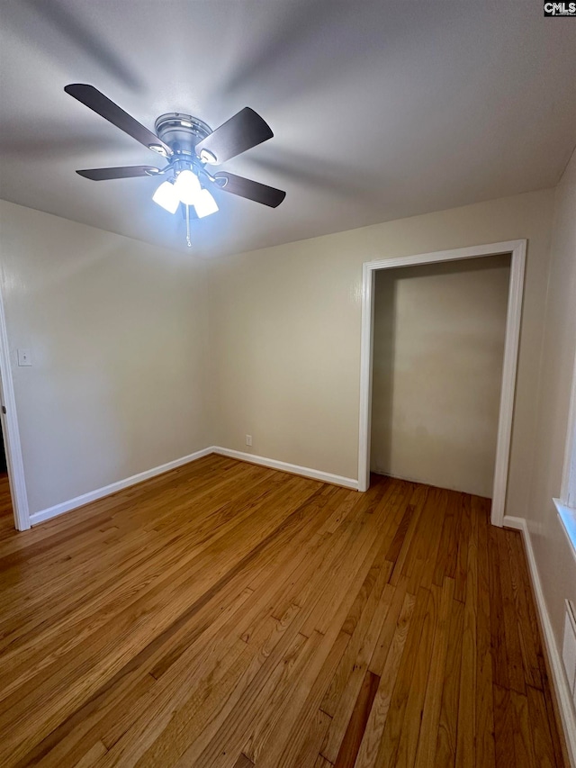 unfurnished room with hardwood / wood-style floors and ceiling fan