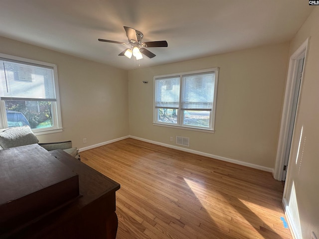 interior space with light hardwood / wood-style floors and ceiling fan