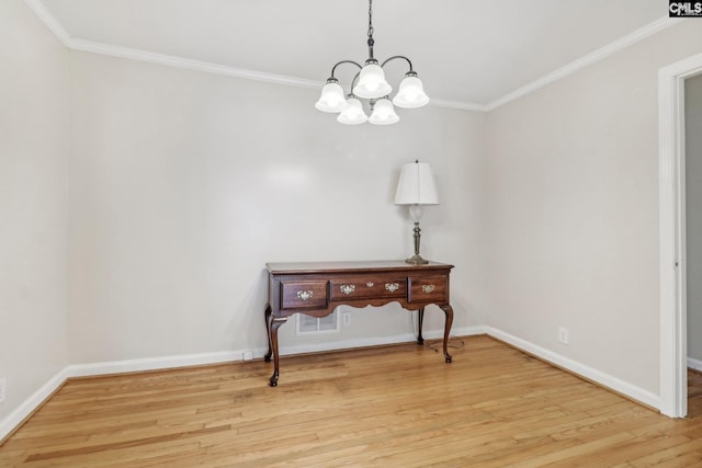 interior space with a chandelier, crown molding, and wood-type flooring