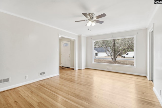 spare room with ceiling fan, light hardwood / wood-style flooring, and crown molding